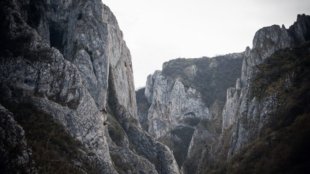 Massive limestone cliffs and rock walls in Turda Gorge, Romania, seen from the right ridge
